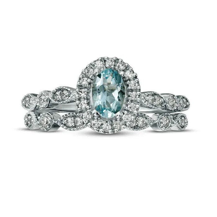 Goldia Rings Oval Aquamarine and 020 CT TW Natural Diamond Frame Antique VintageStyle Bridal Engagement Ring Set in Solid 10K White Gold Goldia Rings Oval Aquamarine and 020 CT TW Natural Diamond Frame Antique VintageStyle Bridal Engagement Ring Set in Solid 10K White Gold