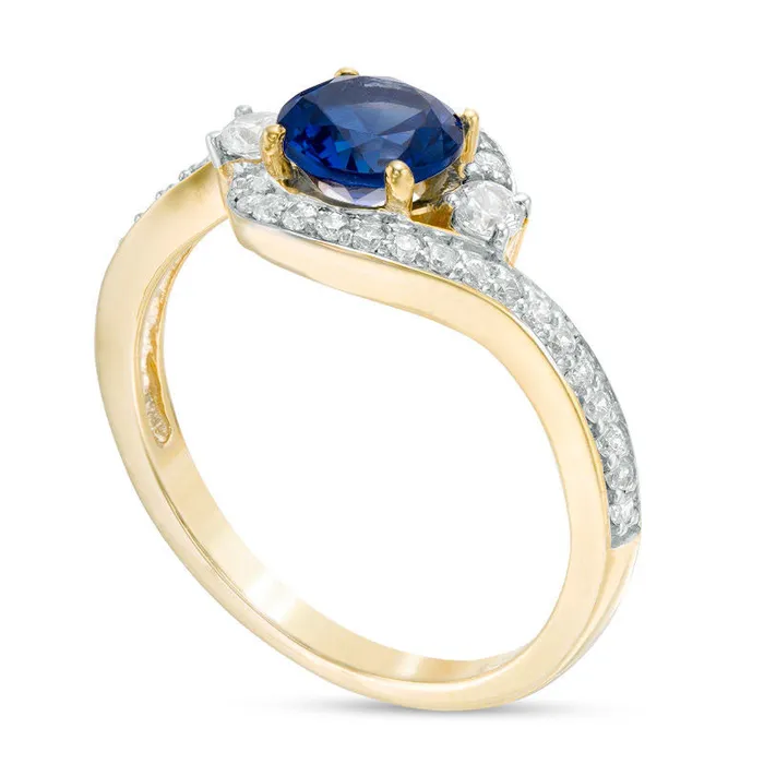 Rings 60mm LabCreated Blue Sapphire and 025 CT TW Diamond Three Stone Bypass Ring in Solid 10K Yellow Gold Goldia Rings 60mm LabCreated Blue Sapphire and 025 CT TW Diamond Three Stone Bypass Ring in Solid 10K Yellow Gold Goldia